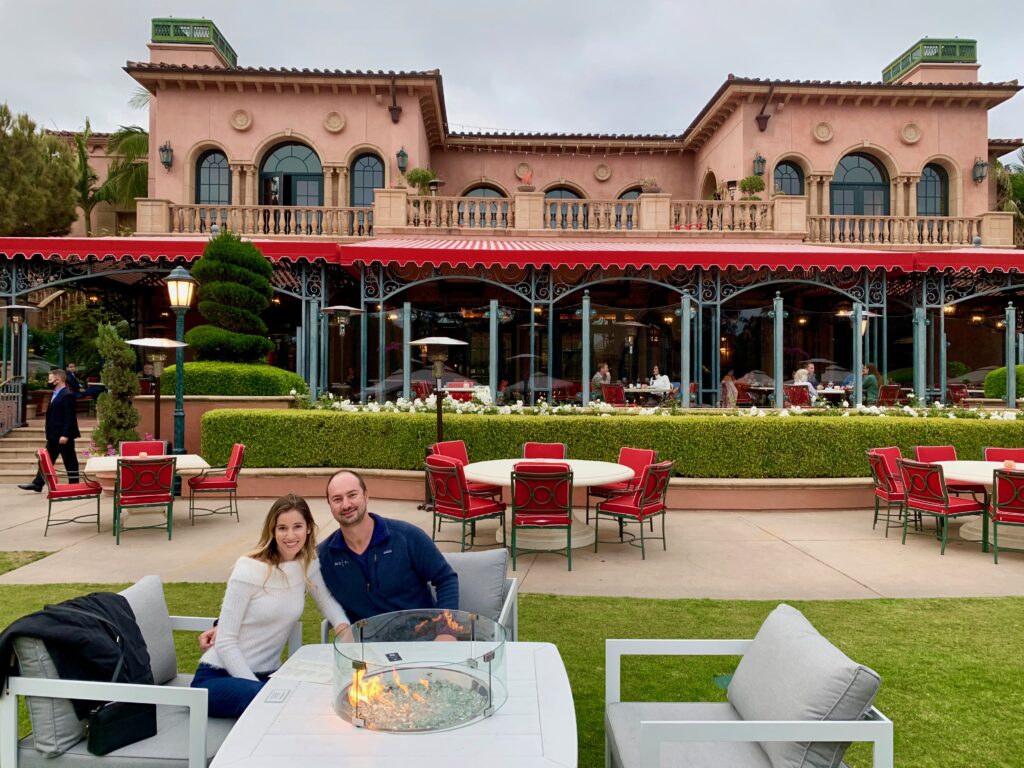 couples sitting in front of fairmont grand Del Mar