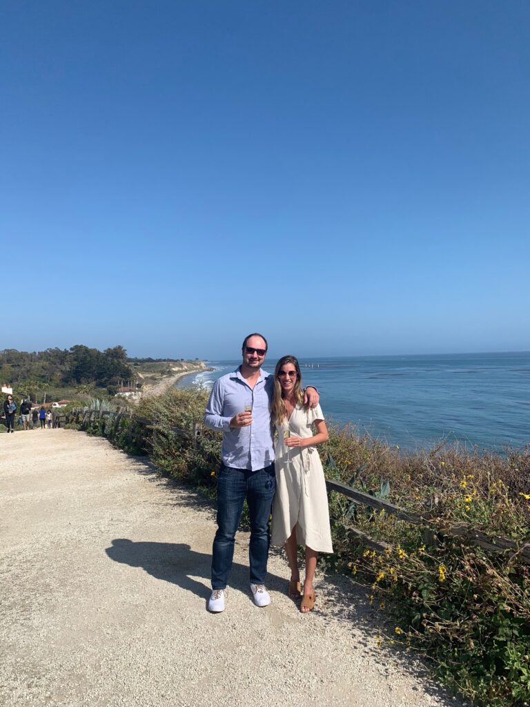 couple holding wine glasses in Santa Barbara