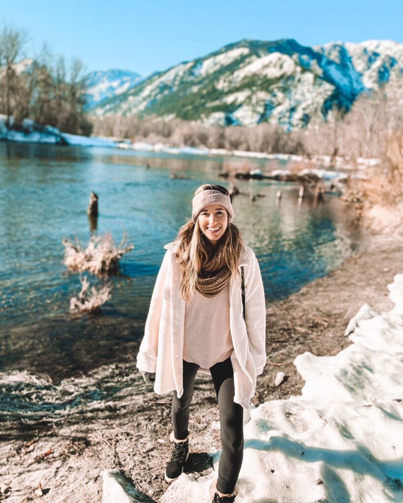 girl in winter clothes along a river in leavenworth